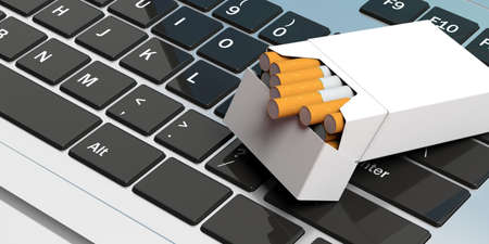 Online cigarettes. No name cigarette packet on computer keyboard. 3d illustrationの写真素材