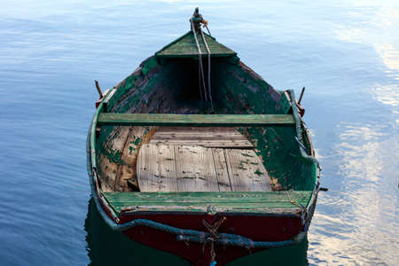 Small fishing boat anchored at the port of Marsaxlokk, Malta. Closeup view