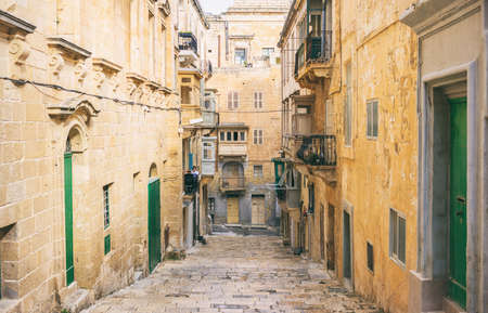 Malta, Valletta. Traditional narrow street with stairs in the historical city centerの写真素材