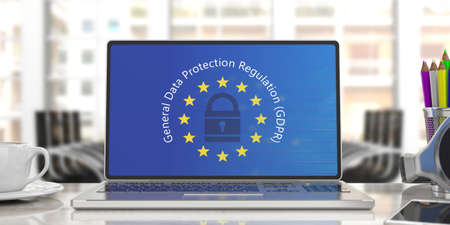 EU GDPR. Computer screen with General Data Protection Regulation text on European Union flag, blur...