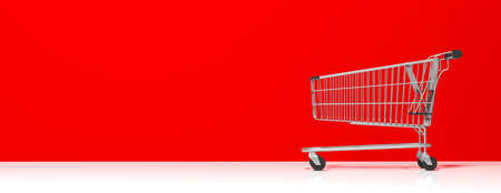 Shopping cart, empty, on bright red wall and white floor background, banner, copy space, side view. 3d illustrationの写真素材
