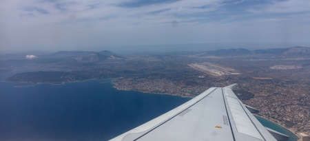 Plane approaching Athens, Greece airport. View out of airplane window.の写真素材