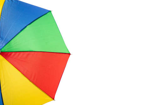 Summer vacation concept. Beach umbrella multicolour, copy space on a white backgroundの写真素材