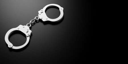Metal police handcuffs isolated on black background, copy space, 3d illustrationの写真素材