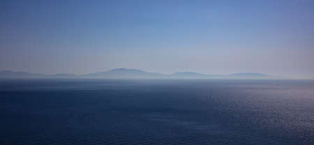 Horizon concept. Blue sky, sea and island background - Greece, Aegean sea, bannerの写真素材