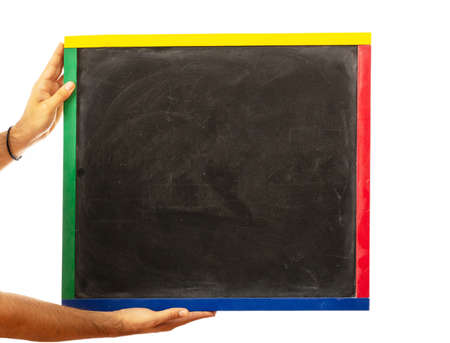 Male hands holding a blank blackboard isolated on white backgroundの写真素材