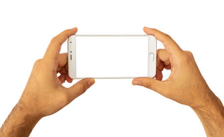 Male hands holding a smartphone with blank screen isolated on white background, clipping path