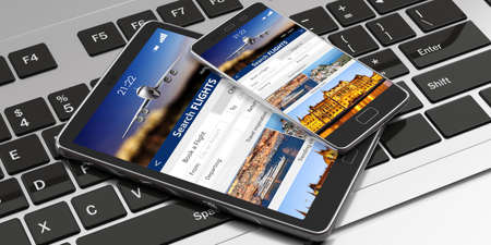 Flights online booking and reservation. Smartphone and tablet on a computer keyboard, Search flights...