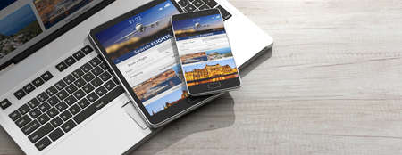 Flights online booking and reservation. Smartphone and tablet on a computer keyboard, Search flights...
