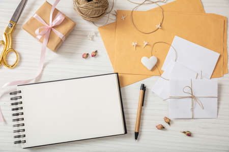 Girl baptism and event invitations preparation. Flat lay and top view of to-do list and invitations...