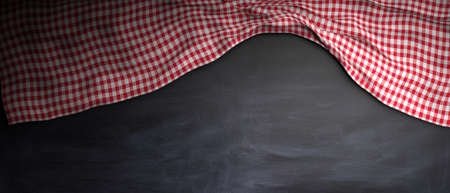 Red and white checkered picnic tablecloth on chalkkboard, copy space. 3d illustrationの写真素材