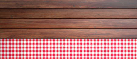 Red and white checkered picnic tablecloth on wooden table, banner, copy space. 3d illustration