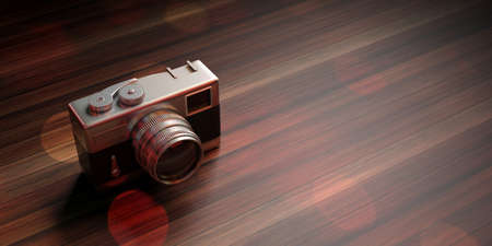 Vintage concept. Isolated retro camera on wooden background, copy space. 3d illustration.の写真素材