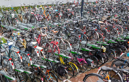 Colorful bicycles in a public two-storey parking station, in the city center of Rotterdam, background.の写真素材