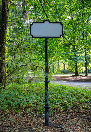 Blank metal sign in theTiergarten park, Berlin, blurred nature backgroundの写真素材