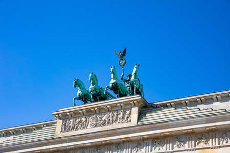 Brandenburg gate in Berlin, Germany, low angle view against blue sky, wallpaper.の写真素材