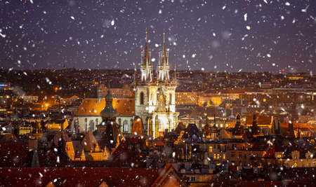 Church of Our Lady in Prague, aerial view at dusk, snowing with gloomy lights, Czech Republicの写真素材
