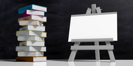 Education concept. Whiteboard on folding wooden easel, isolated against black background and a pile of colorful books, 3d illustration.の写真素材