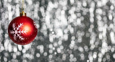 Christmas ball and snow in the night, abstract bokeh lights background, banner, copy space