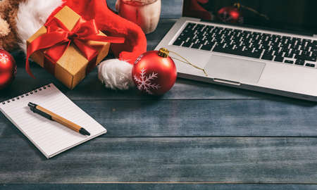 Christmas decoration and a computer laptop on an office desk, copy spaceの写真素材