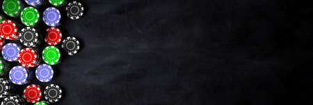 Gambling, casino concept. Poker chips piles on black background, banner, copy space, top view. 3d illustrationの写真素材