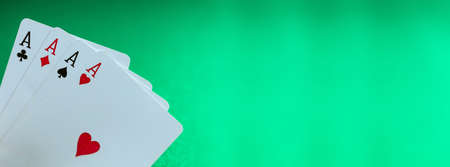 Poker, casino playing cards, concept. Four aces on green felt background, banner, copy spaceの写真素材