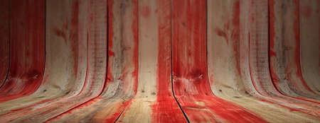 Red painted and faded curved wooden planks, texture background, banner. Wooden wall and floor for presentationの写真素材
