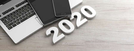 New year 2020 and electronic devices. 2020 number, computer, laptop, tablet and mobile phone, wooden...