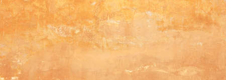 Stucco painted wall texture background, yellow beige color, italian style, banner