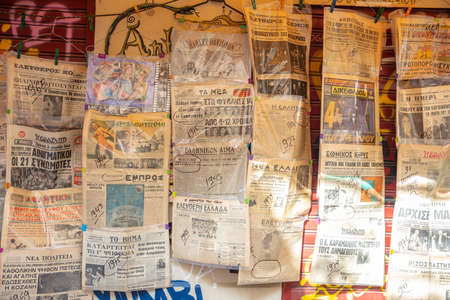 February 19, 2019. Athens Greece, city center. Old greek newspapers collection at Monastiraki area, backgroundのeditorial素材