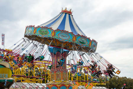 October 7, 2018. Munich, Germany, Oktoberfest, Carousel on cloudy sky backgroundのeditorial素材