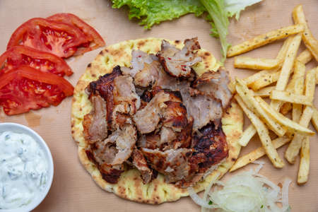 Shawarma, gyros pita. Traditional turkish, greek meat food on pita bread, top viewの写真素材