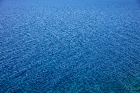 Deep blue sea water surface. Calm sea background texture, high angle view