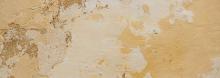 Beige yellow color, painted and faded wall texture grunge background, banner