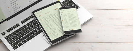 Email and electronic devices. Email lists on smartphone and tablet screens, computer keyboard and...