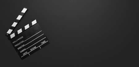Cinama film concept. Movie clapper board on black color background, banner, copy spaceの写真素材