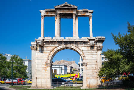 April 17, 2019. Athens Greece. Handrian gate, Zeus olympian ancient temple, outdoor ruins against blue sky background, front viewのeditorial素材