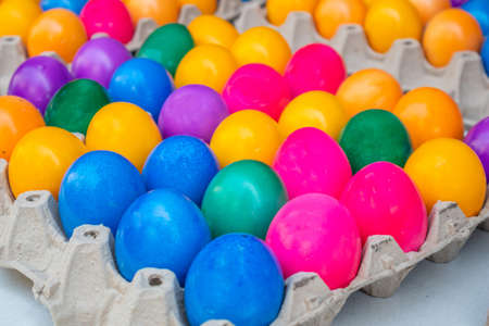 Orthodox Easter. Colorful eggs in carton packaging, close up view, full background