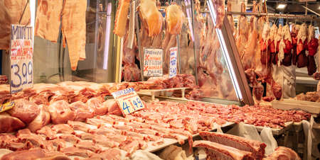 April 28, 2019. Athens, Greece. Fresh pork chops in a row out of a butcher shop. Pig meat in big pieces for selling. Store background.のeditorial素材
