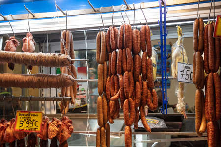 April 28, 2019. Athens, Greece. Sausages, kokorec, kokoretsi, kokorech, bowel are hanging on hooks out of butcher store. Meat market background.のeditorial素材