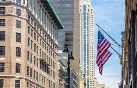 USA symbol in New York streets. American flags on a classical building, Manhattan downtown, business areaの写真素材