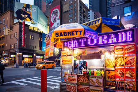USA, New York, Manhattan. May 3, 2019. Broadway streets at night. Take away fast food kiosk,...