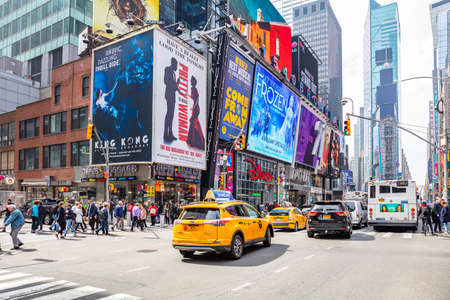 USA, New York, Times Square. May 2, 2019. High modern buildings, colorful neon lights, large commercial ads, cars and people in a spring dayのeditorial素材
