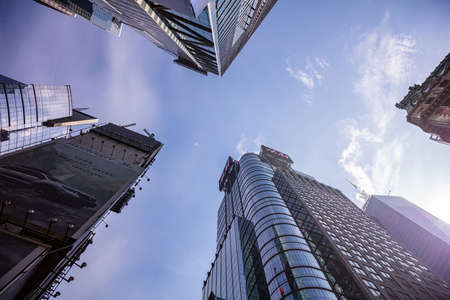 New York, USA. May 2nd, 2019. Manhattan commercial center. Skyscrapers perspective view against blue sky background, low angle viewのeditorial素材