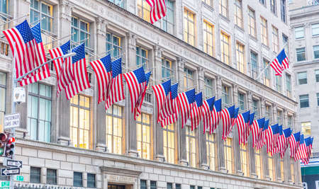 New York, USA. May 3rd, 2019. USA symbol in New York streets. American flags on a classical building, Manhattan downtown, business areaのeditorial素材