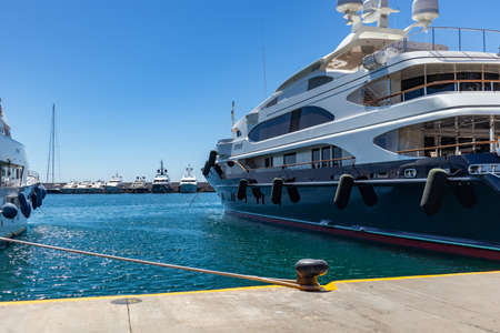 April 29, 2019. Marina Zeas in Piraeus, Greece. Luxury yacht moored at harbor ready to sail. Blue sky and calm sea background, space.のeditorial素材