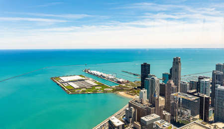 Chicago cityscape aerial view, spring day. High rise buildings and lake Michiganl, blue sky background. High angle view from skydeckの写真素材
