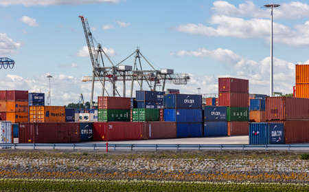 Rotterdam harbor, Netherlands. July 2nd, 2019. Logistics business. Huge bridge cranes and stacked containers, international port of Rotterdam, sunny summer dayのeditorial素材