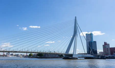Rotterdam, Netherlands. July 2nd, 2019. Cityscape and Erasmus bridge, sunny day. Waterfront buildings at river Maasのeditorial素材