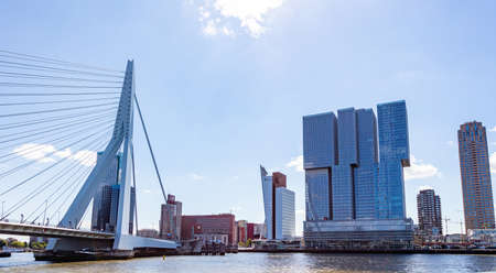 Rotterdam, Netherlands. July 2nd, 2019. Cityscape and Erasmus bridge, sunny day. Waterfront buildings at river Maasのeditorial素材